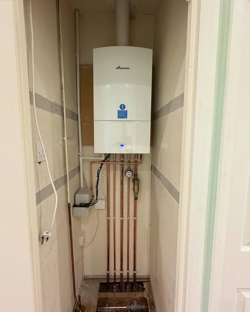 A combi boiler with copper pipework, fitted by Addisons